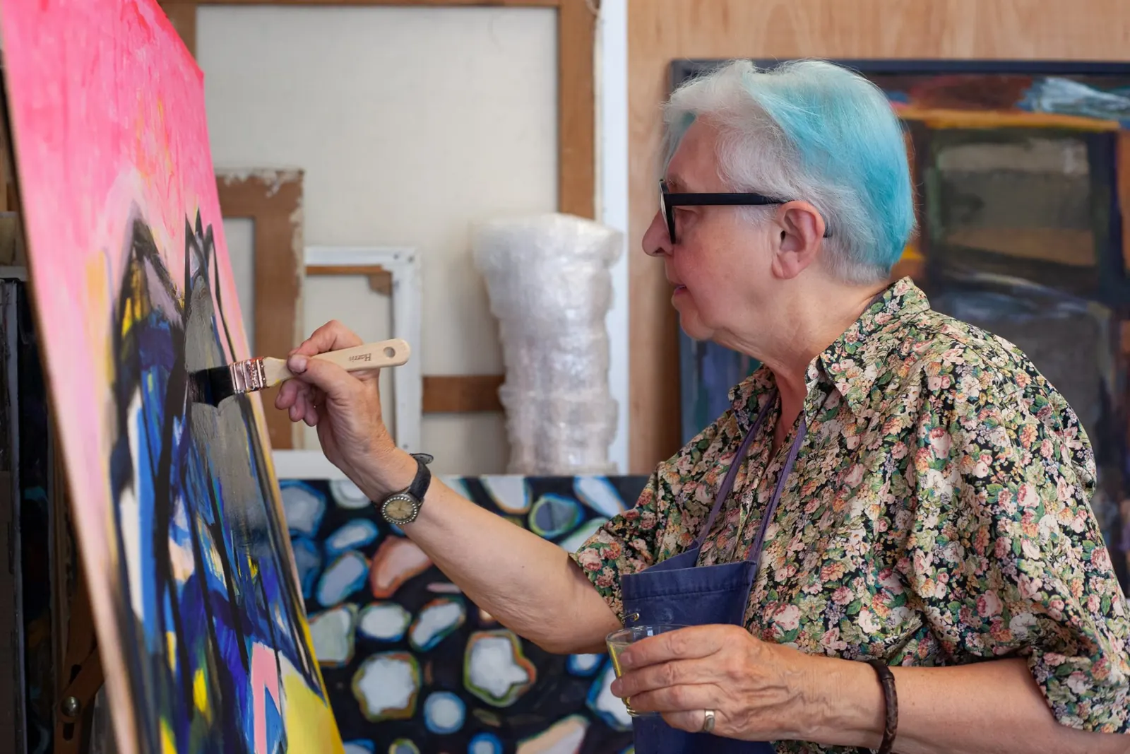 Artist painting in her studio at Create Space London