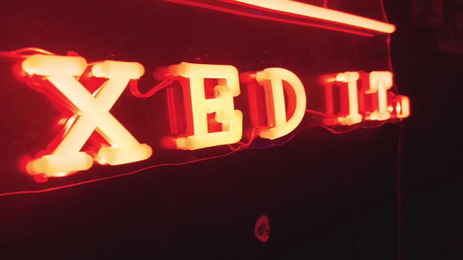 Neon sign in the studio, still from Creatives Don't Care episode 2