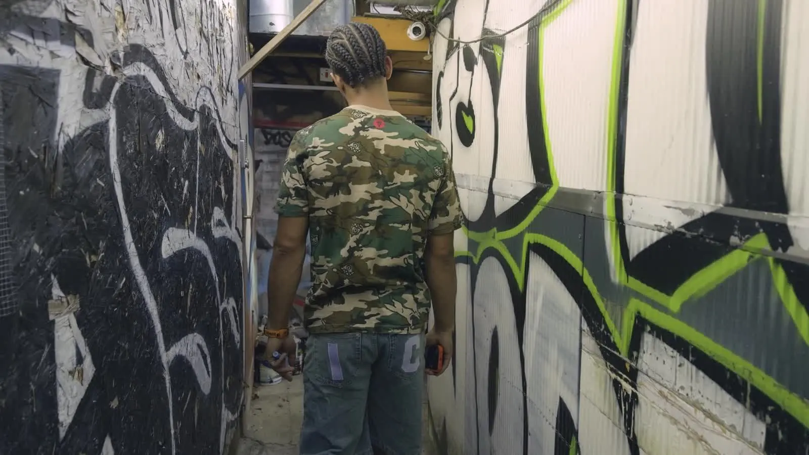 43Hyperactive walking past graffiti, still from Creatives Don't Care episode 2