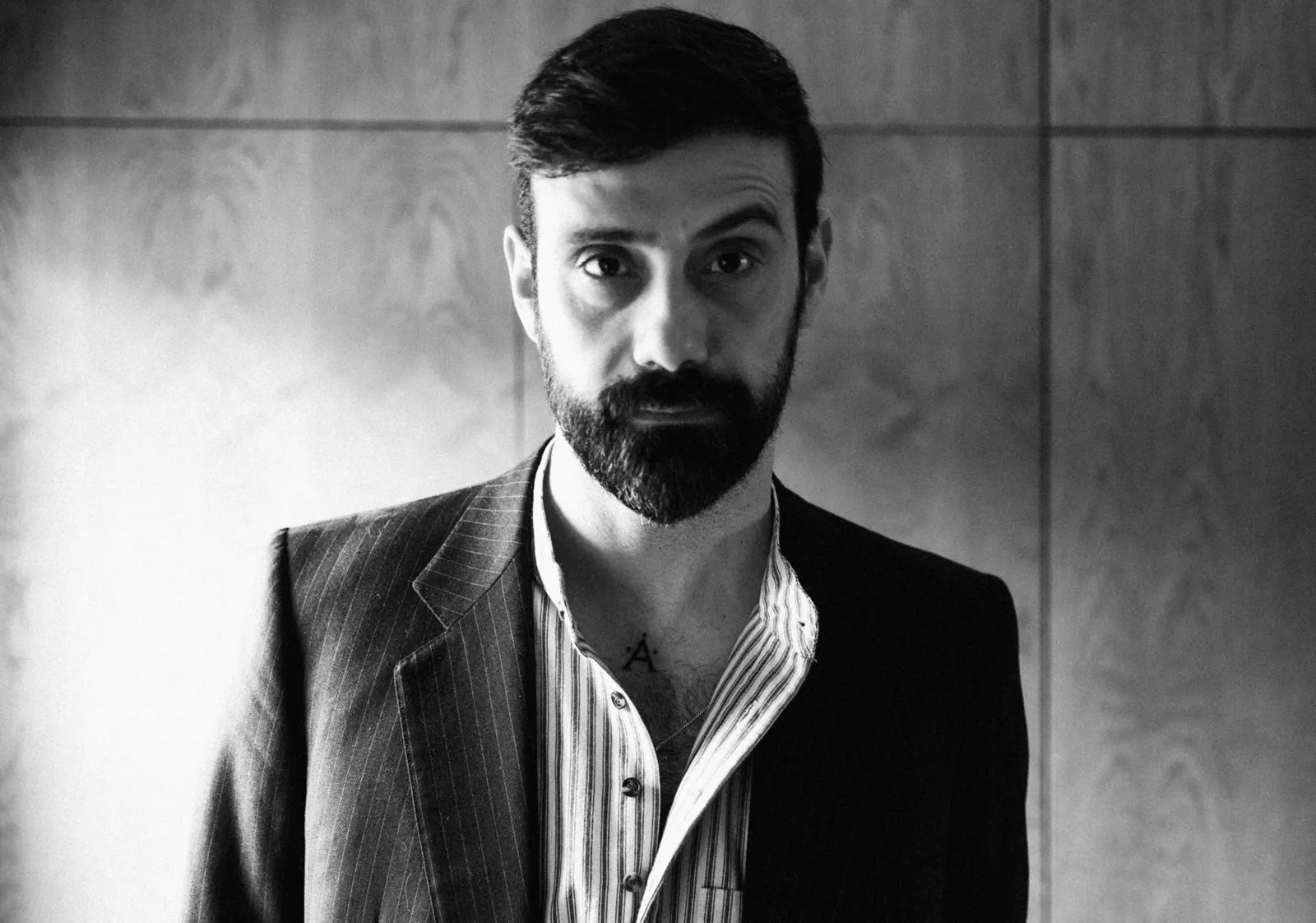 Black and white portrait of a man in a jacket, London