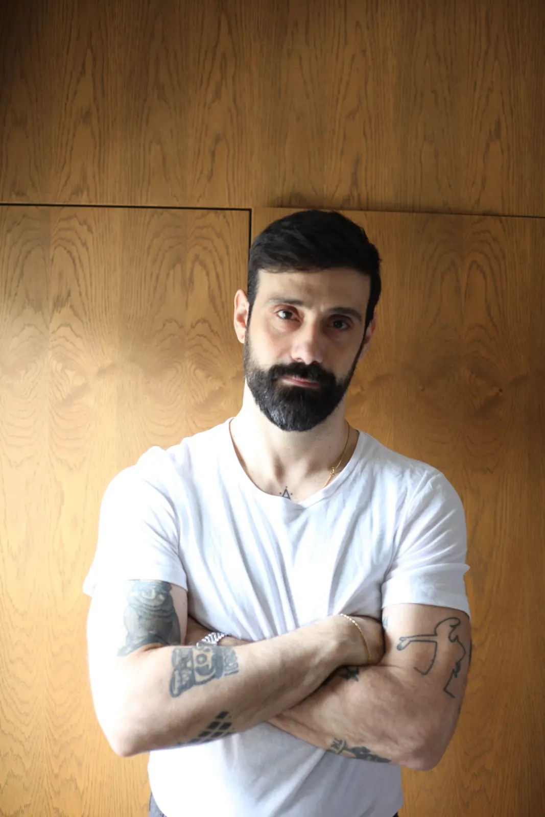 Natural light portrait of a man in a white t-shirt, London