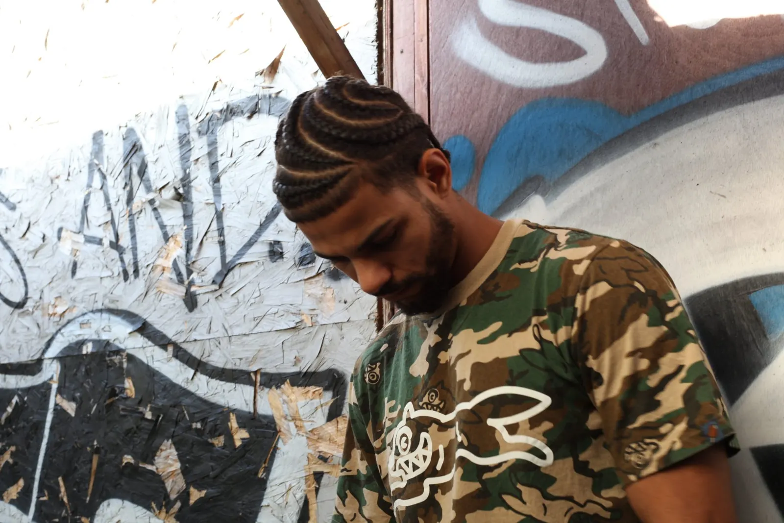 Portrait of the musician 43Hyperactive against graffiti, London